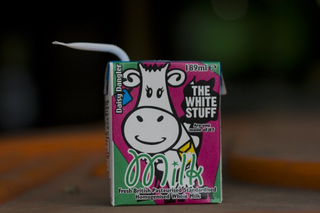 NDC school-milk carton printed THE WHITE STUFF — Are you made of it? (illustration; an on-pack/schools campaign, not a mustache campaign)